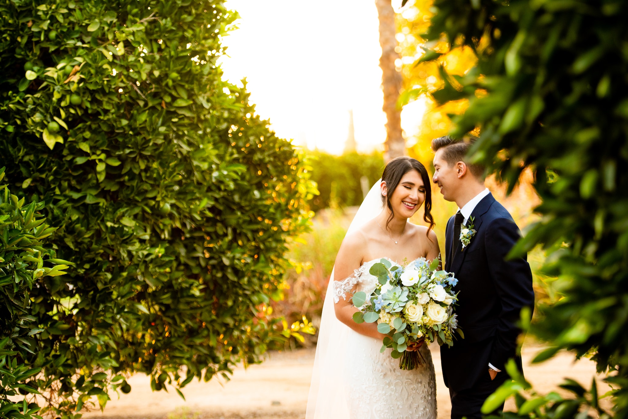 woman in white wedding dress holding bouquet of flowers