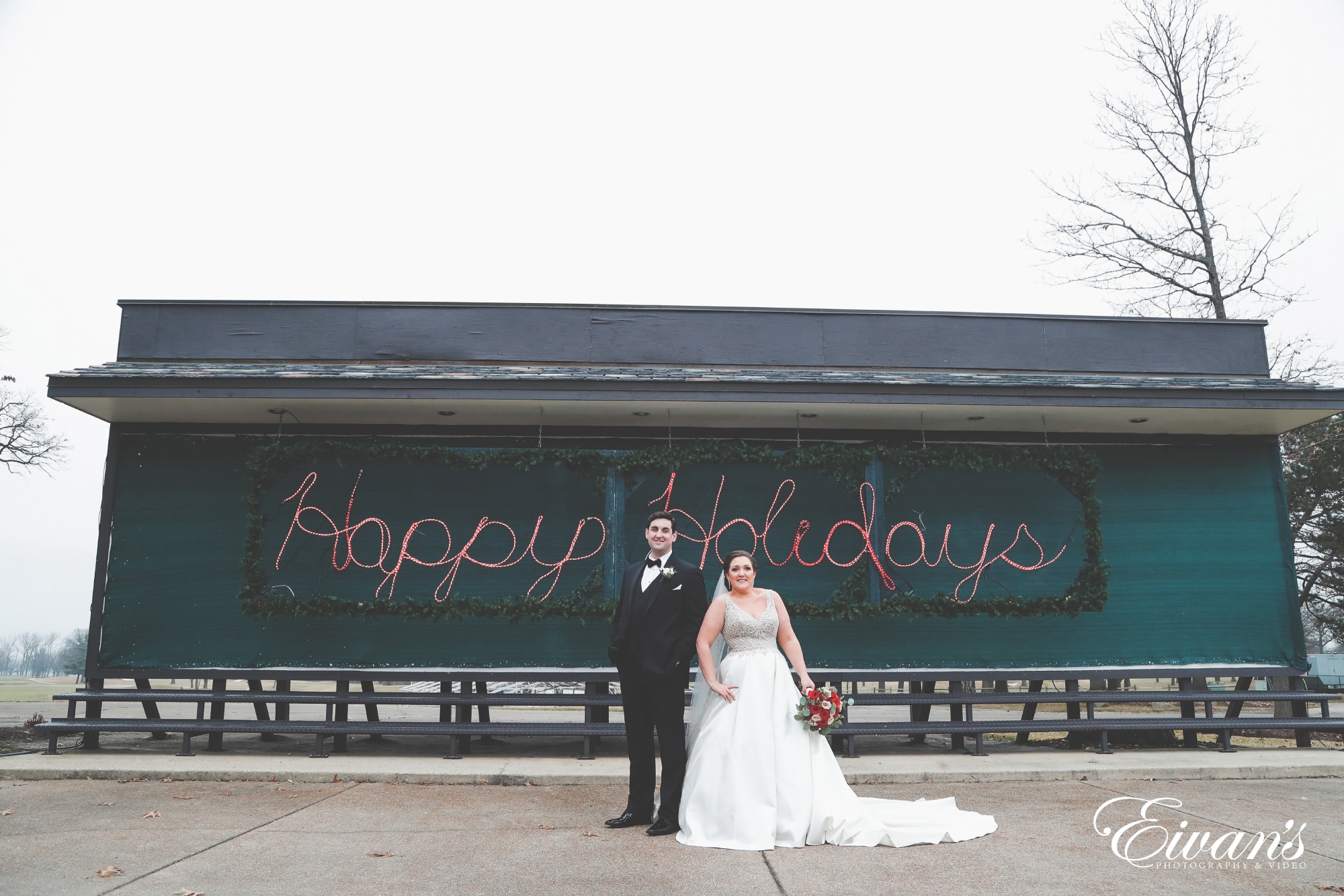 bride and groom standing on the sidewalk
