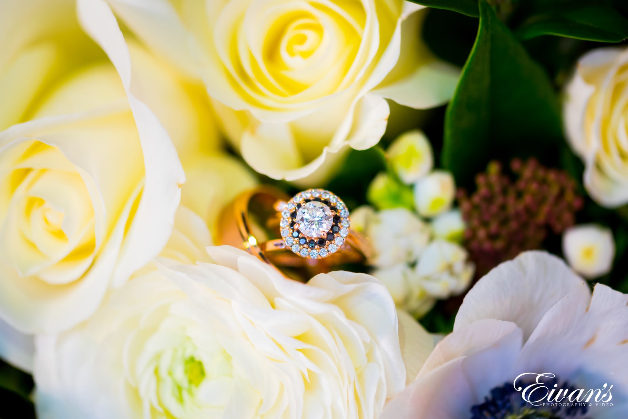 silver diamond ring on white flower