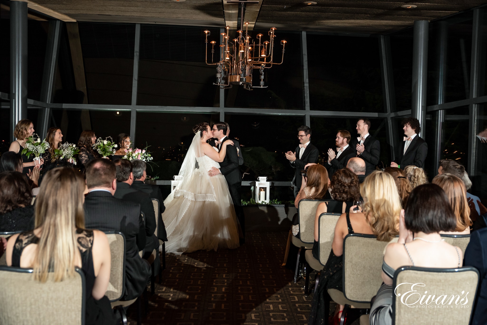 bride and groom sitting on chair