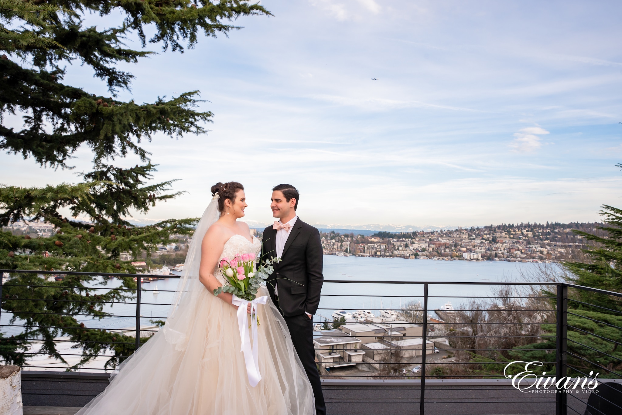 man in black suit and woman in white wedding dress