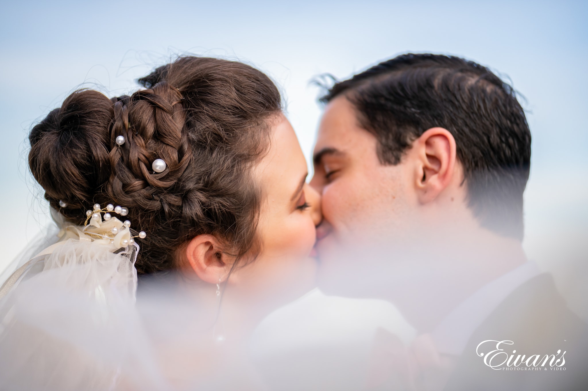 man and woman kissing each other