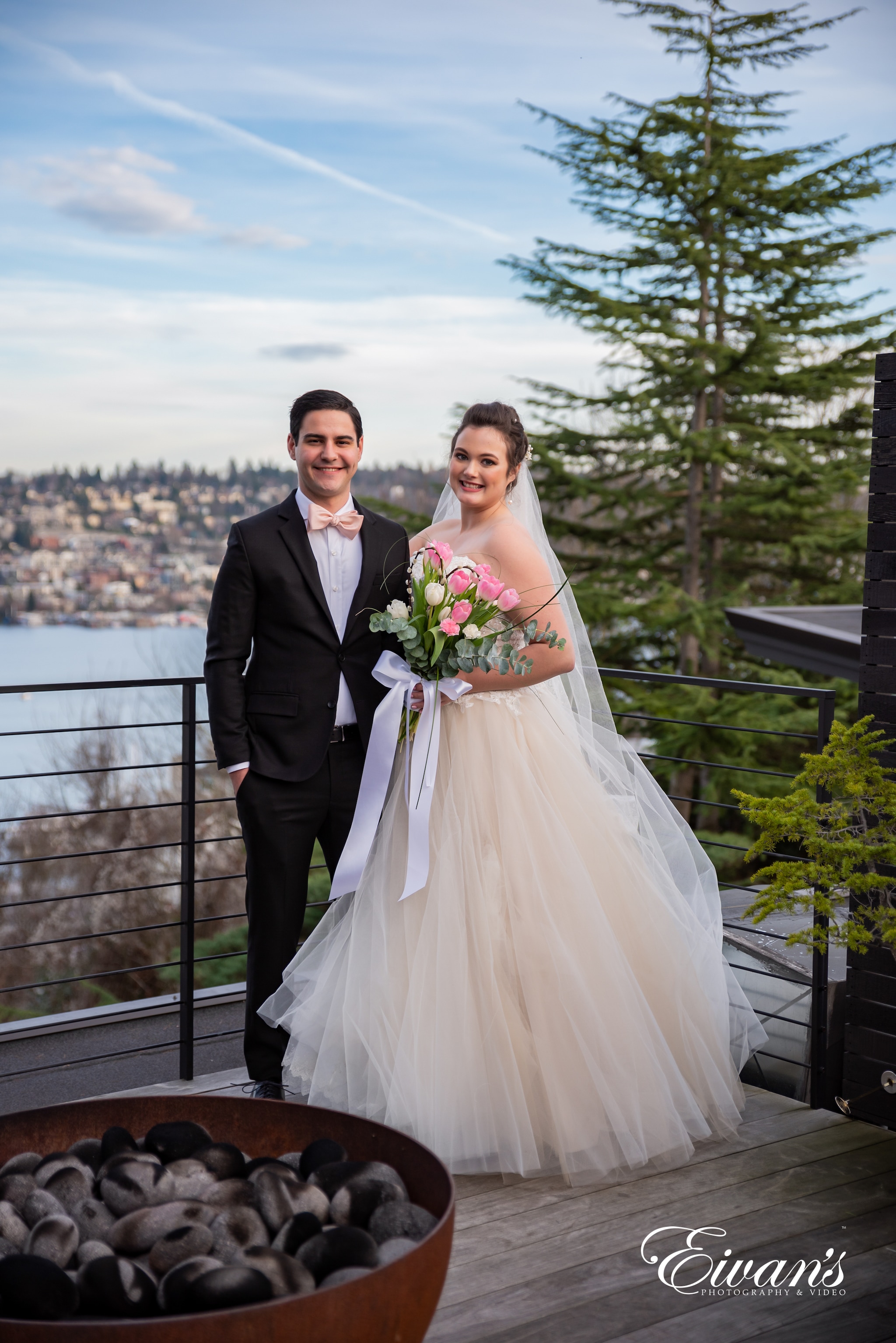 man in black suit jacket and woman in white wedding dress