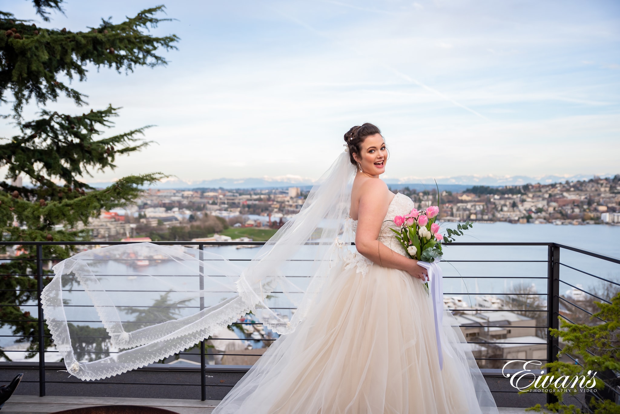 woman in white wedding dress standing on bridge during daytime