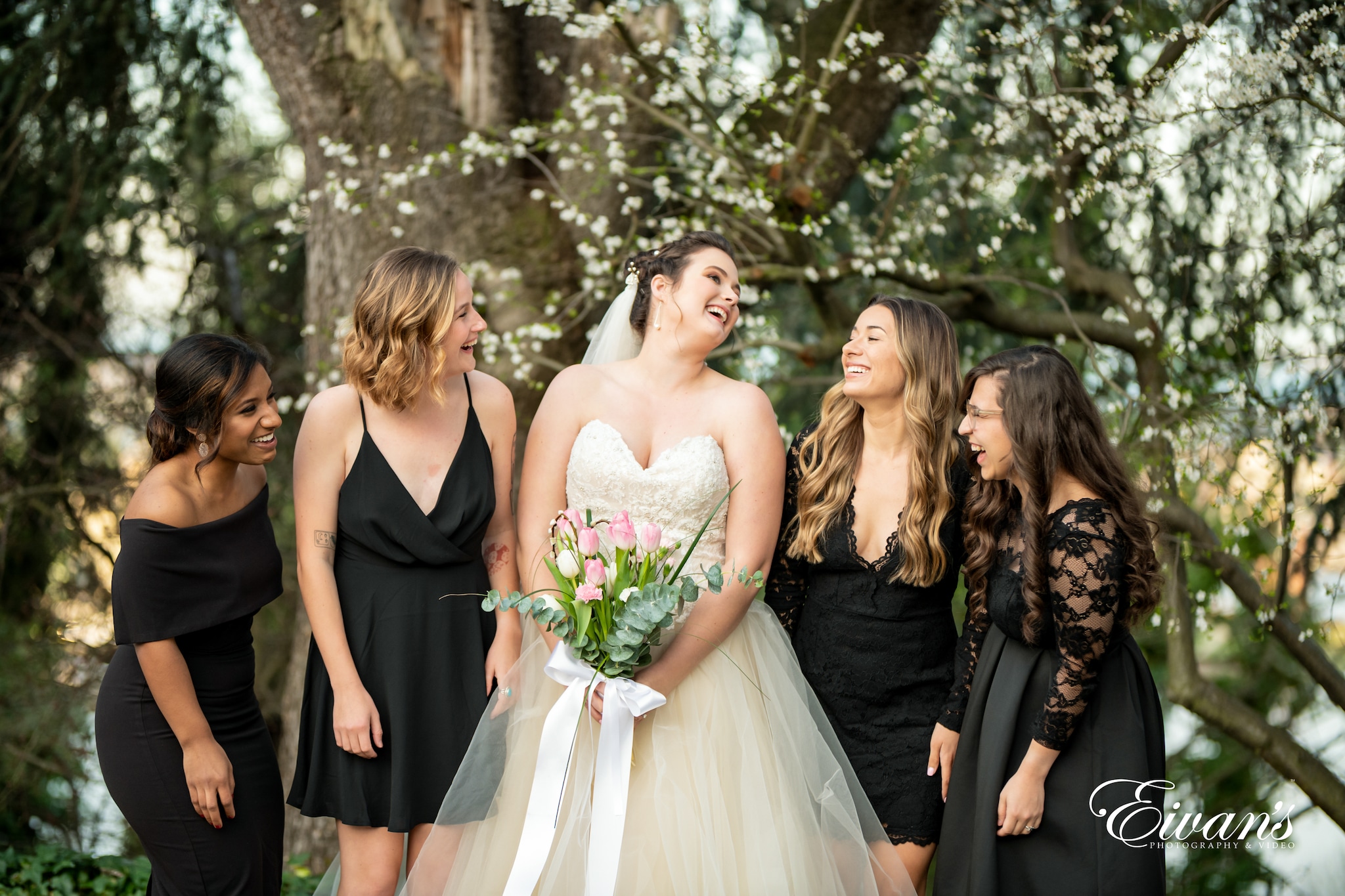 woman in white wedding gown standing beside woman in black dress