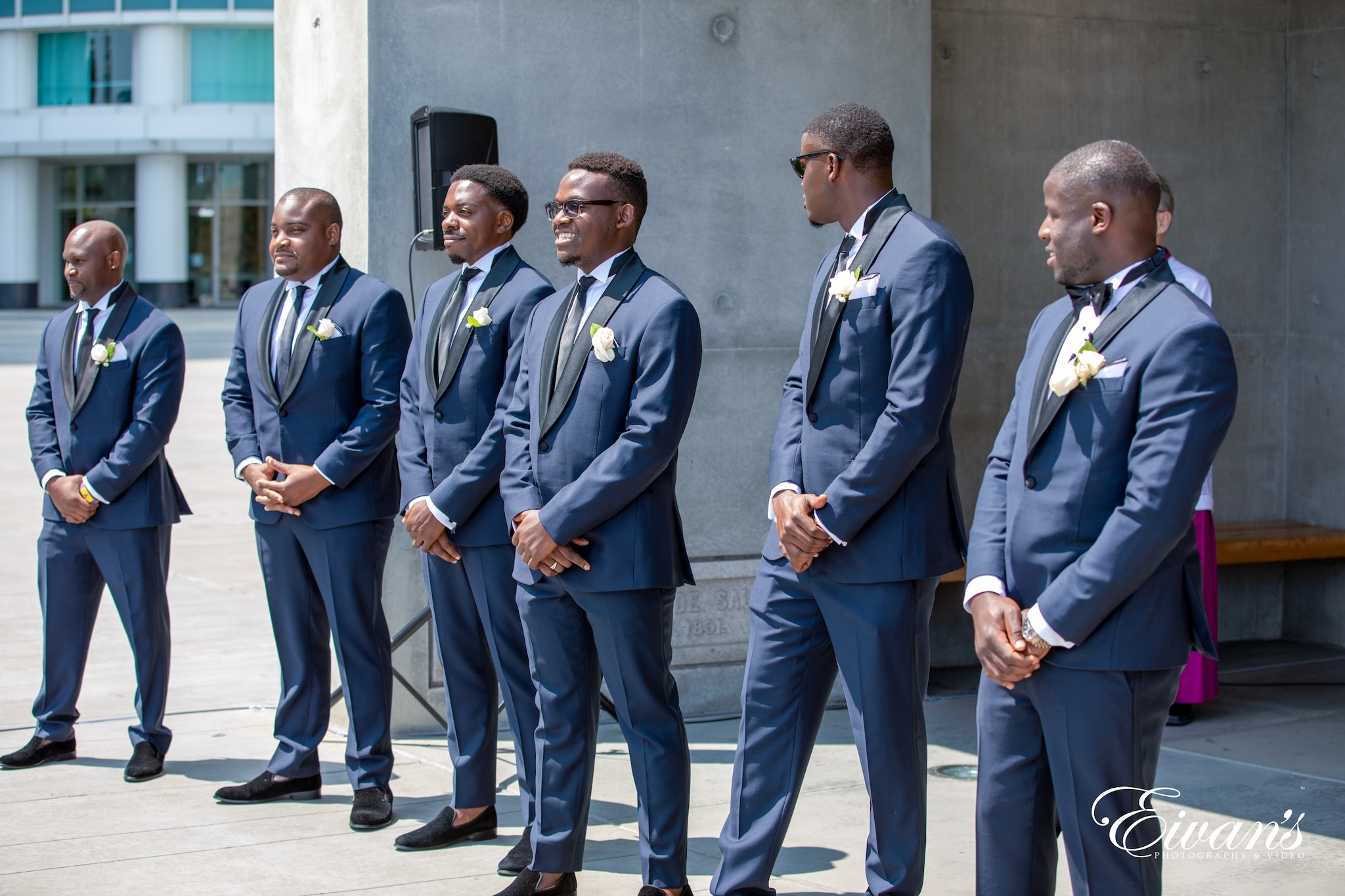 2 men in blue suit standing beside each other