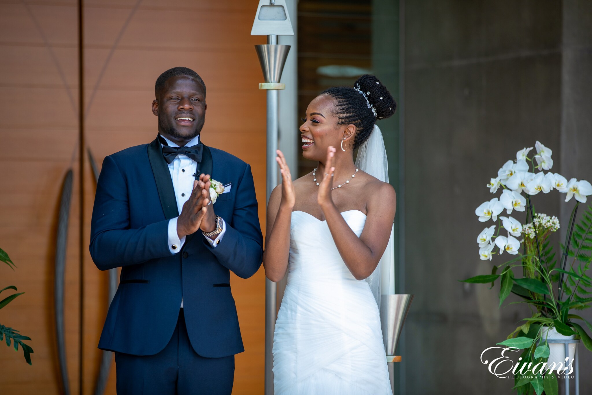 man in black suit and woman in white dress