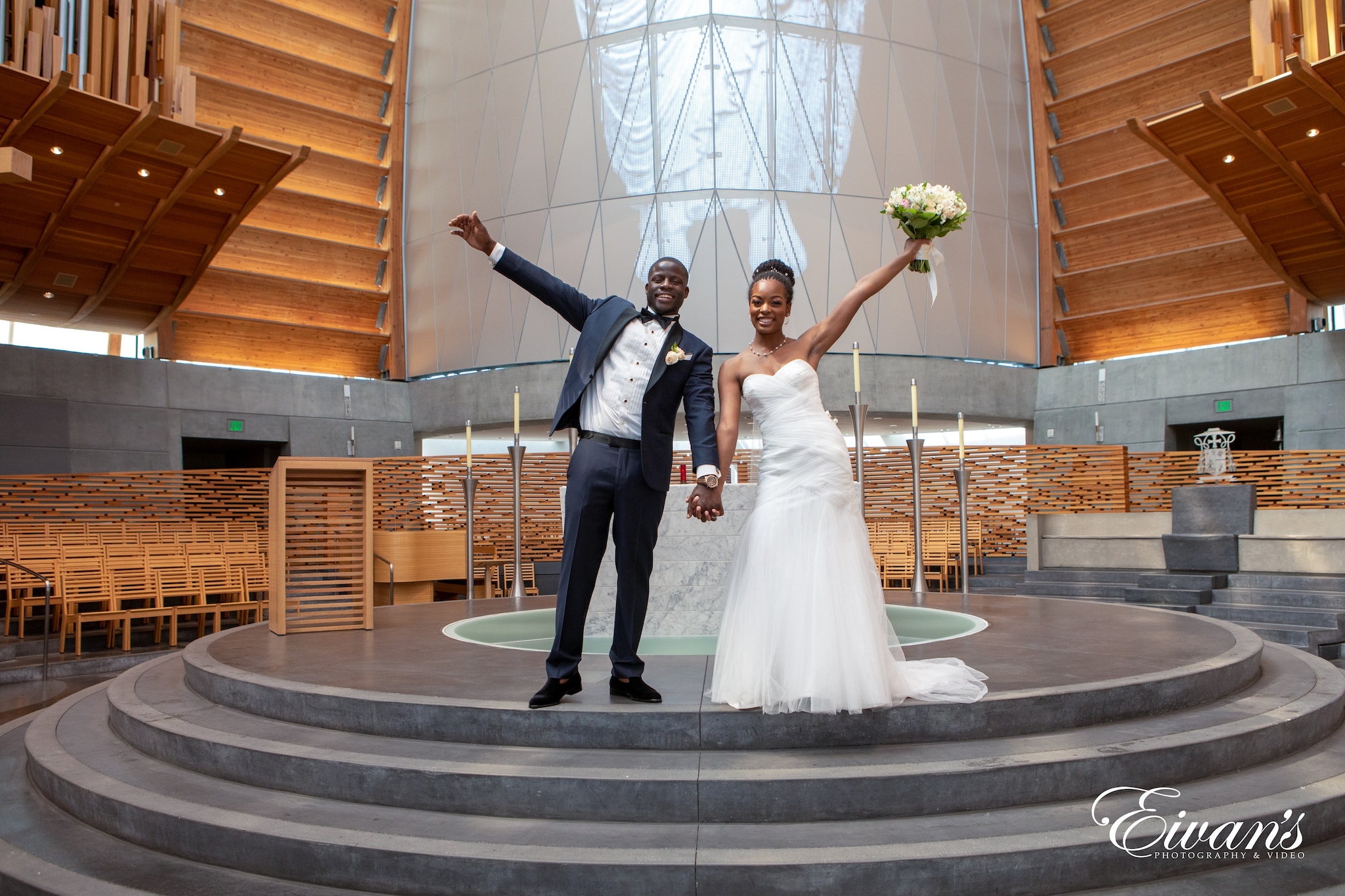 man in black suit and woman in white wedding dress