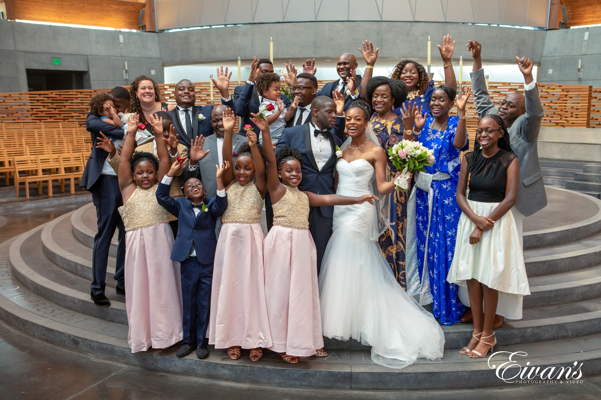 group of women in white and pink dresses standing on brown wooden floor