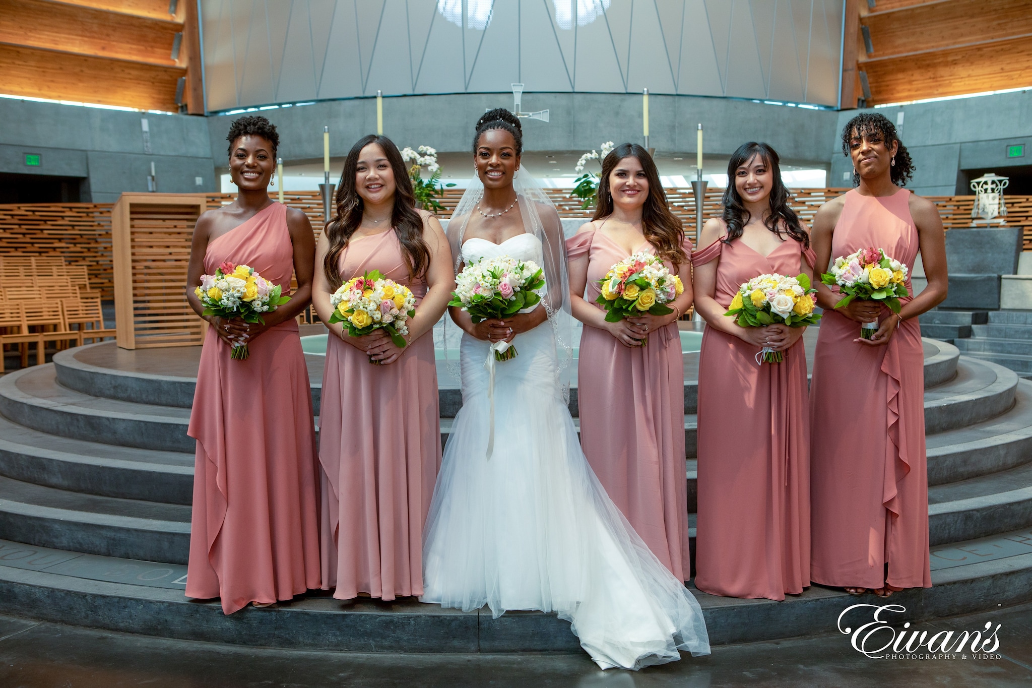 woman in white wedding gown holding bouquet of flowers