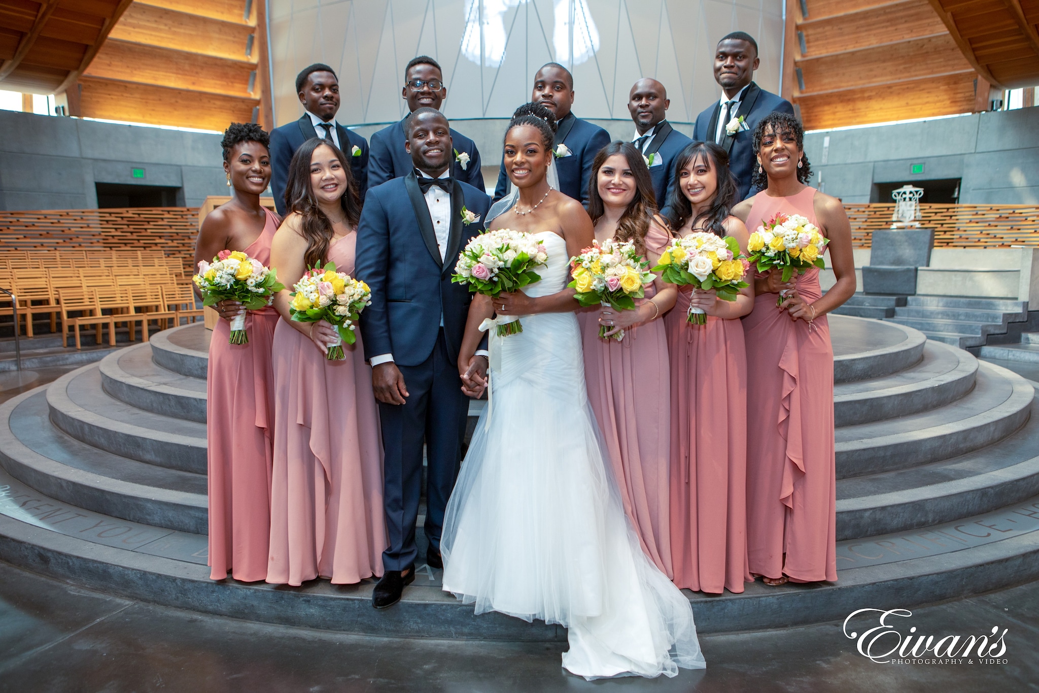 bride and groom standing on gray concrete floor