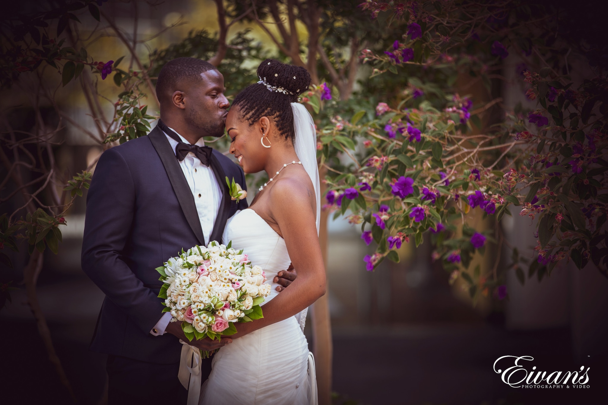 woman in white wedding dress holding bouquet of flowers
