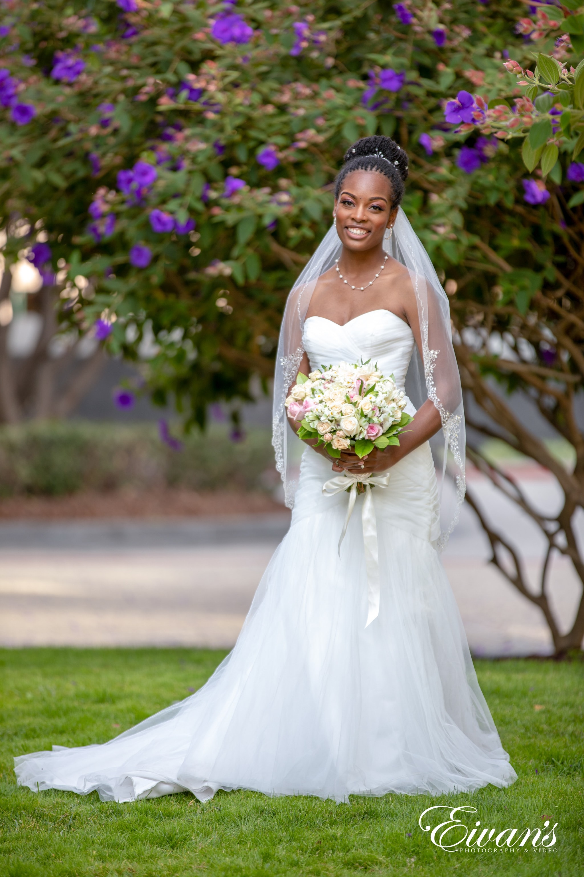 woman in white wedding dress holding bouquet of flowers