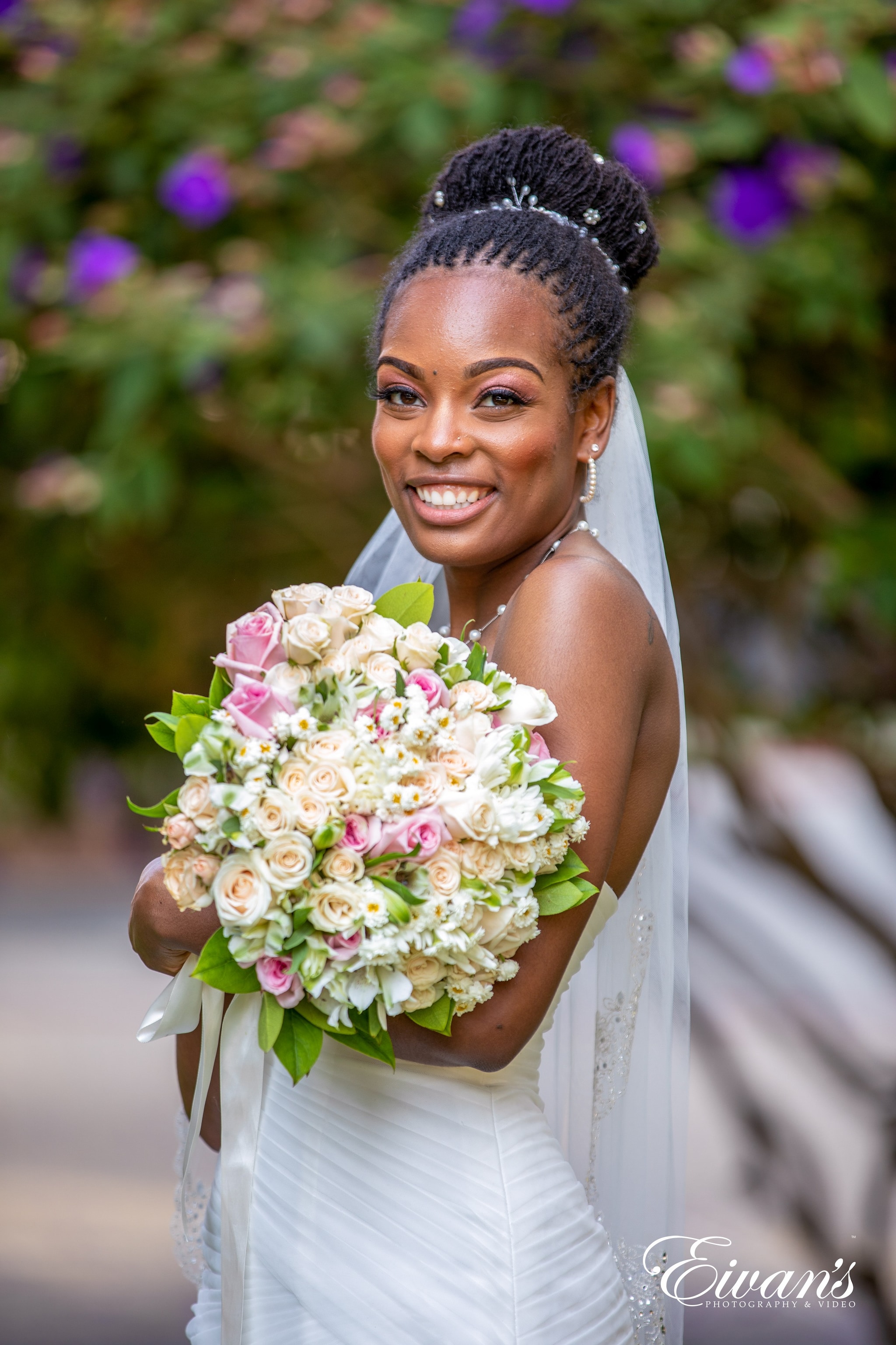 woman in white wedding dress holding bouquet of flowers