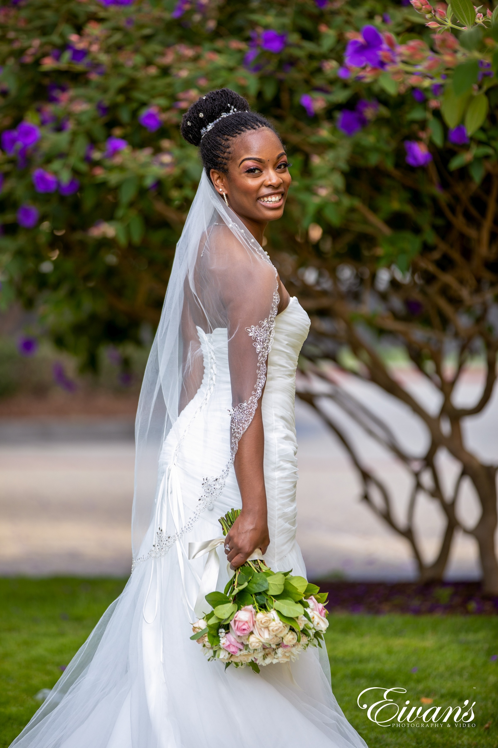 woman in white wedding dress holding bouquet of flowers