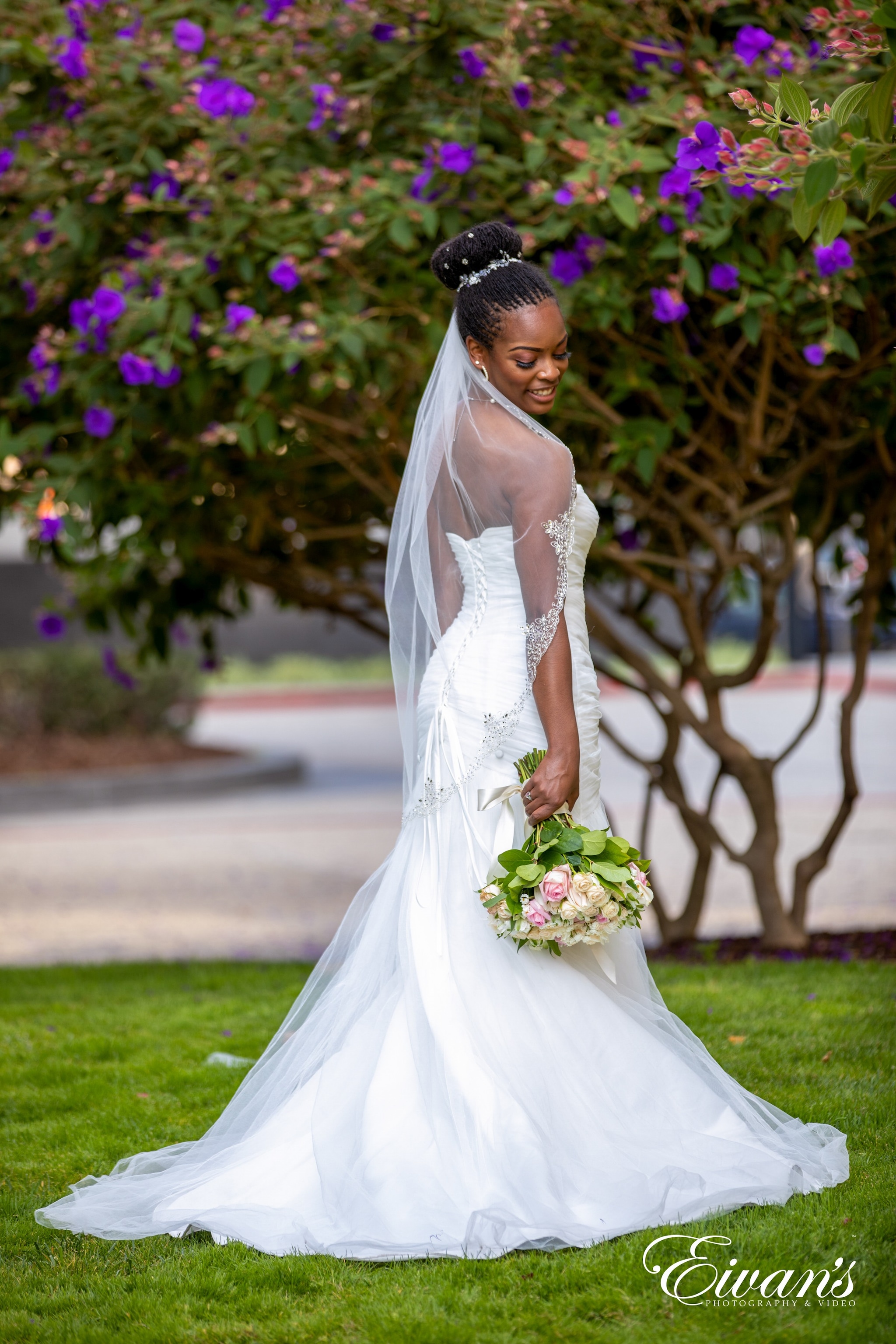 woman in white wedding dress holding bouquet of flowers