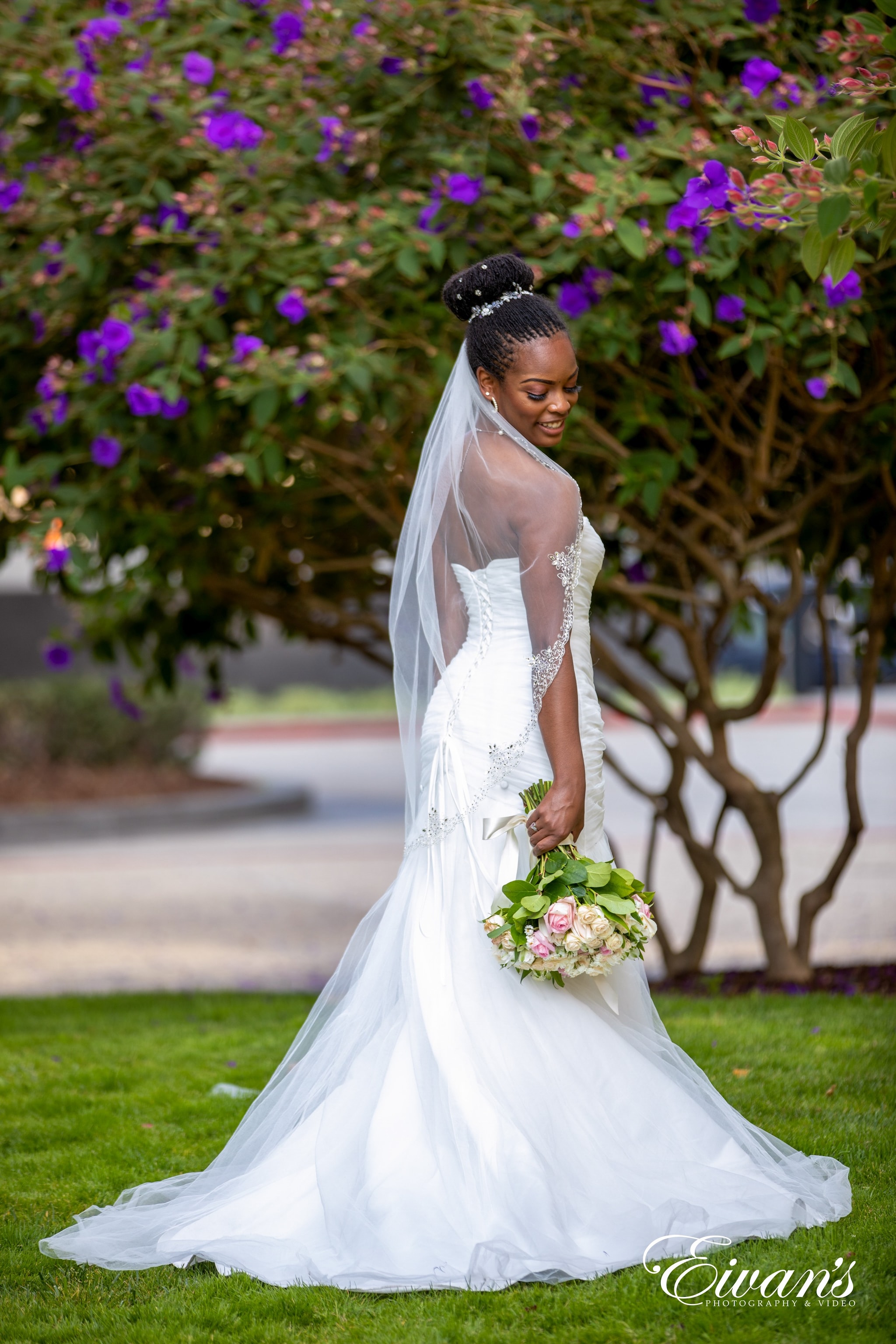 woman in white wedding dress holding bouquet of flowers