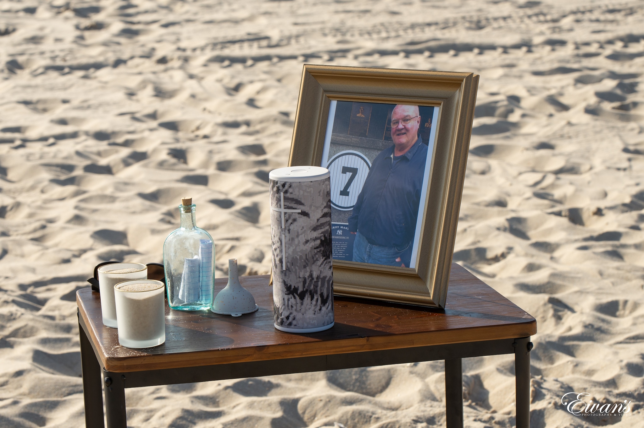 brown wooden framed photo of man in blue long sleeve shirt