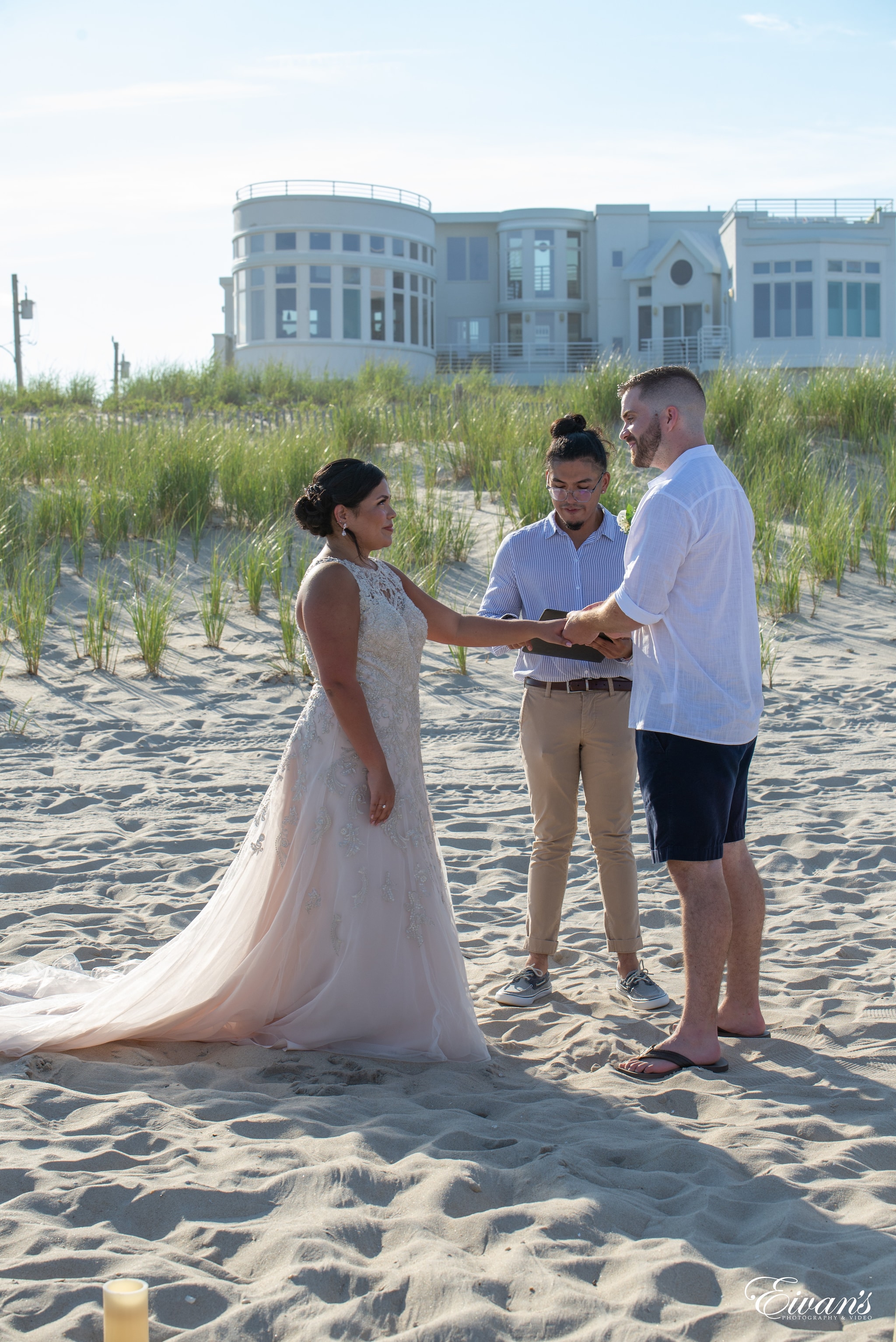 man and woman holding hands on beach during daytime