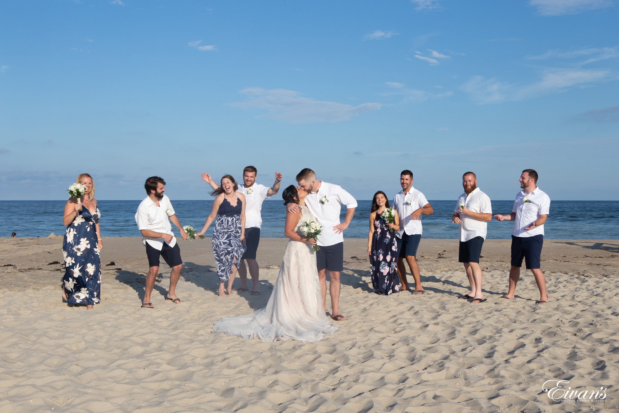 group of people standing on beach during daytime