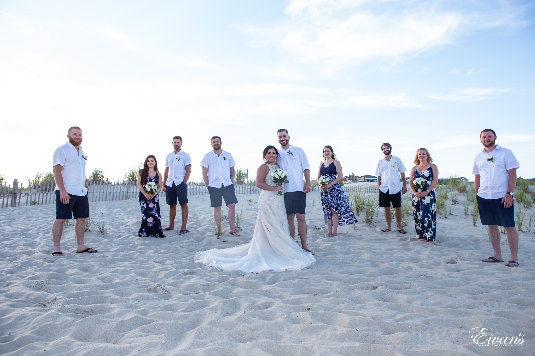 group of people standing on beach during daytime