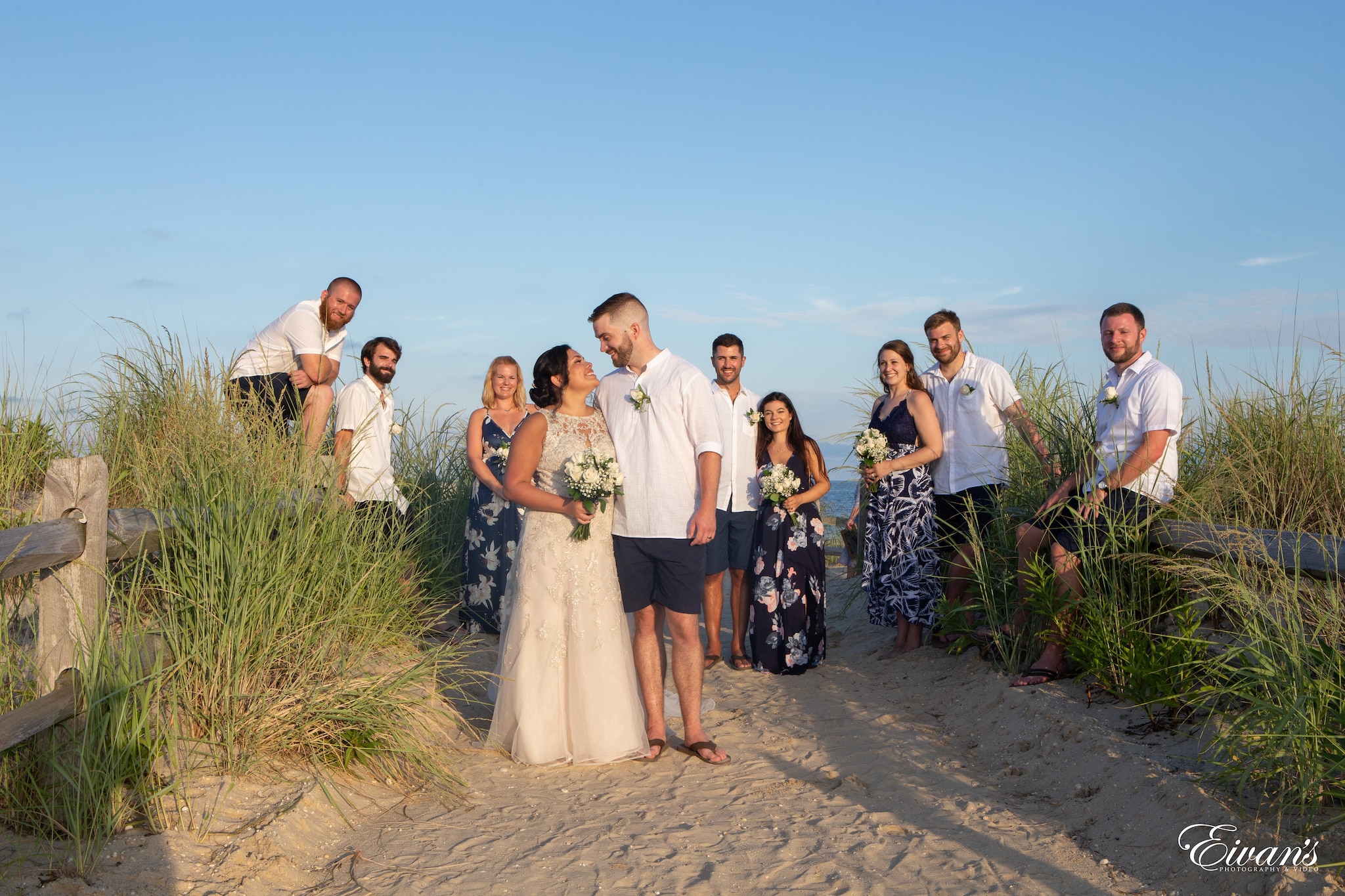 group of people standing on brown sand during daytime