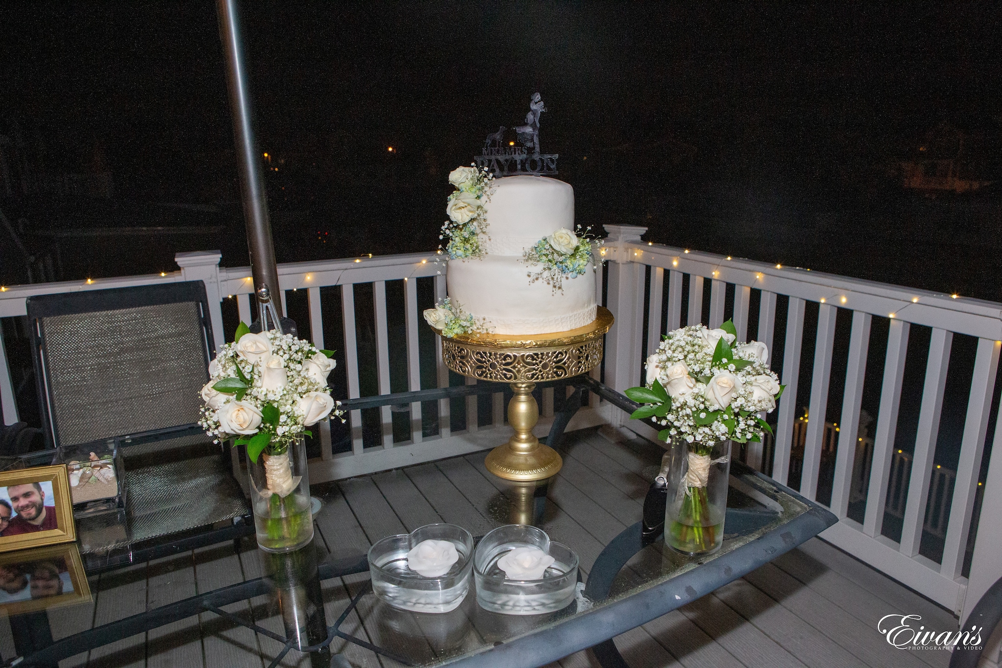 white and gold floral cake on glass table