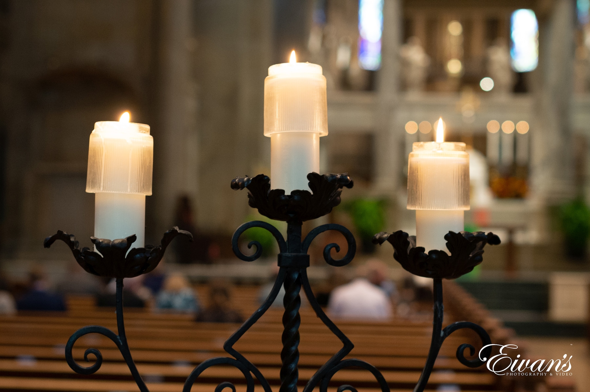 black metal candle holder with white candles