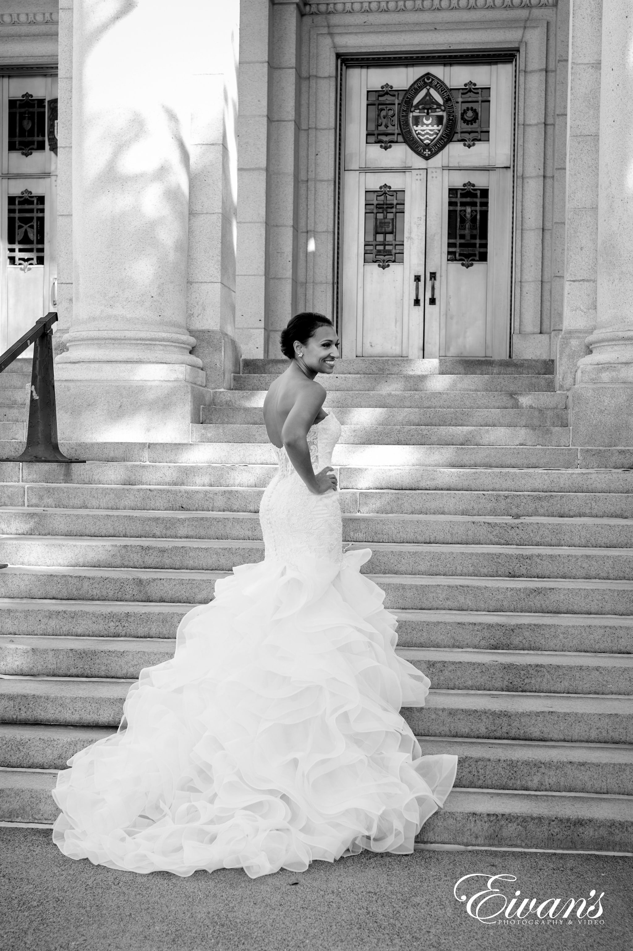 woman in white wedding dress walking on stairs