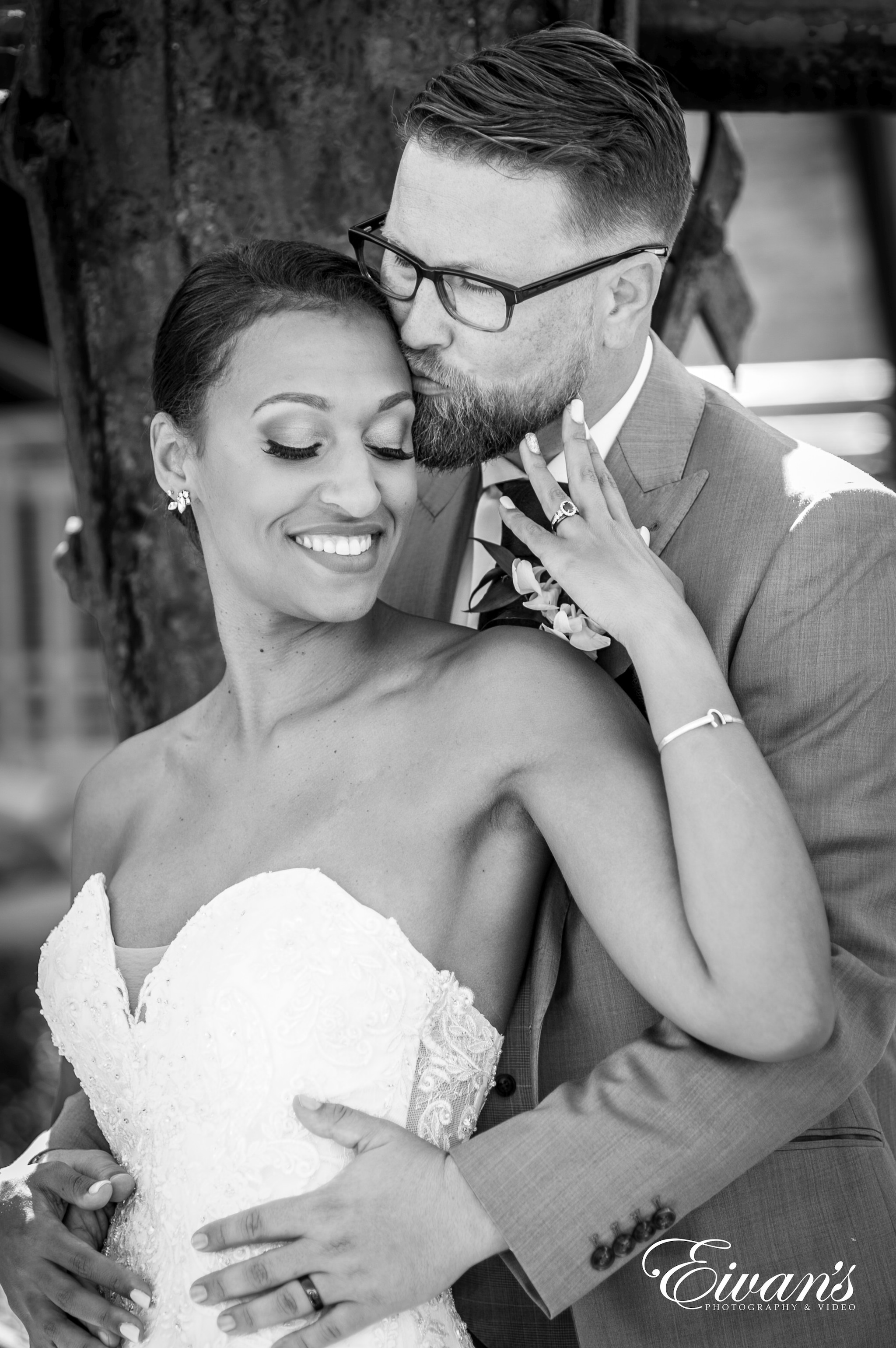 grayscale photo of man and woman kissing