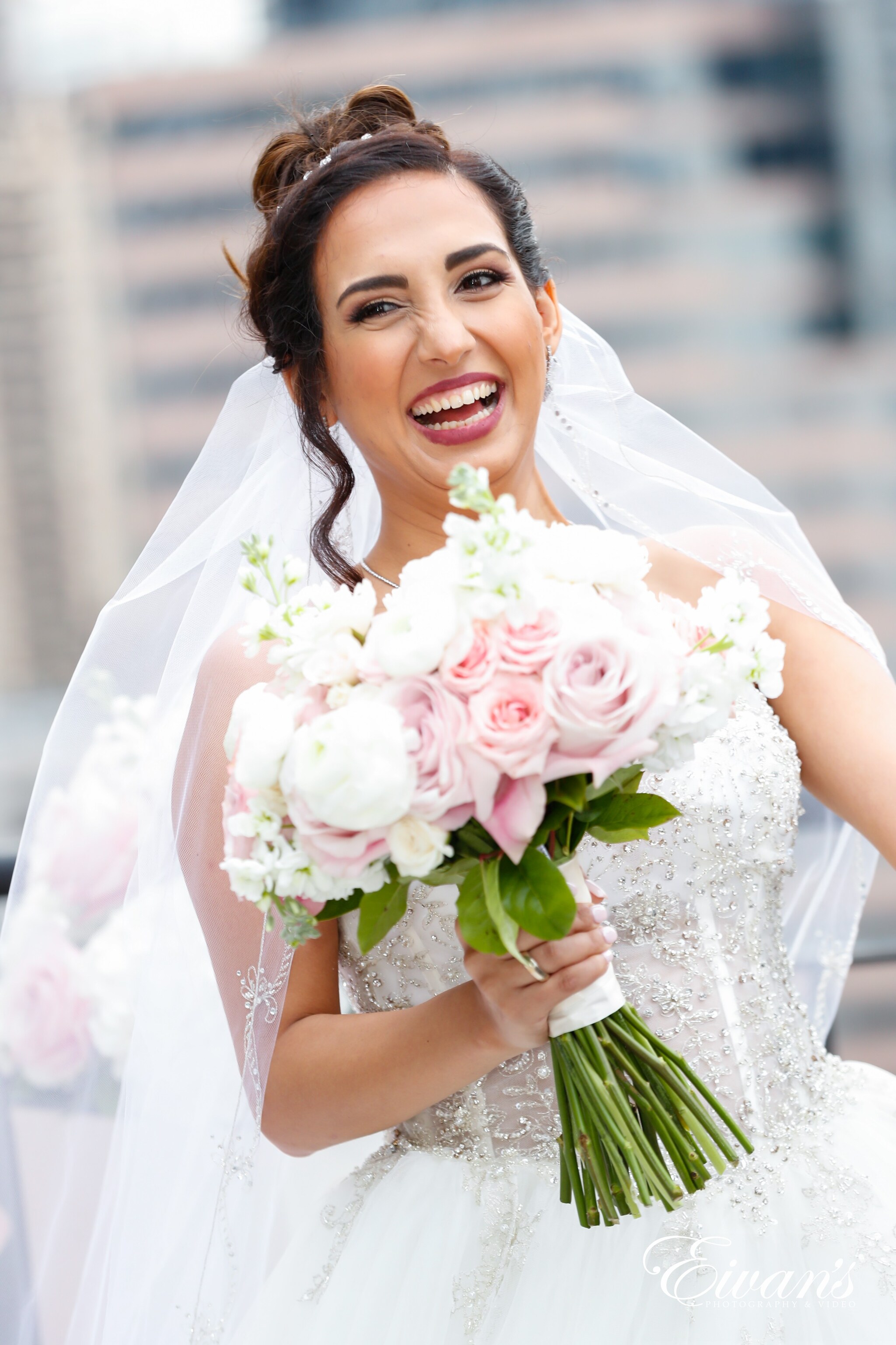 woman in white wedding dress holding bouquet of flowers