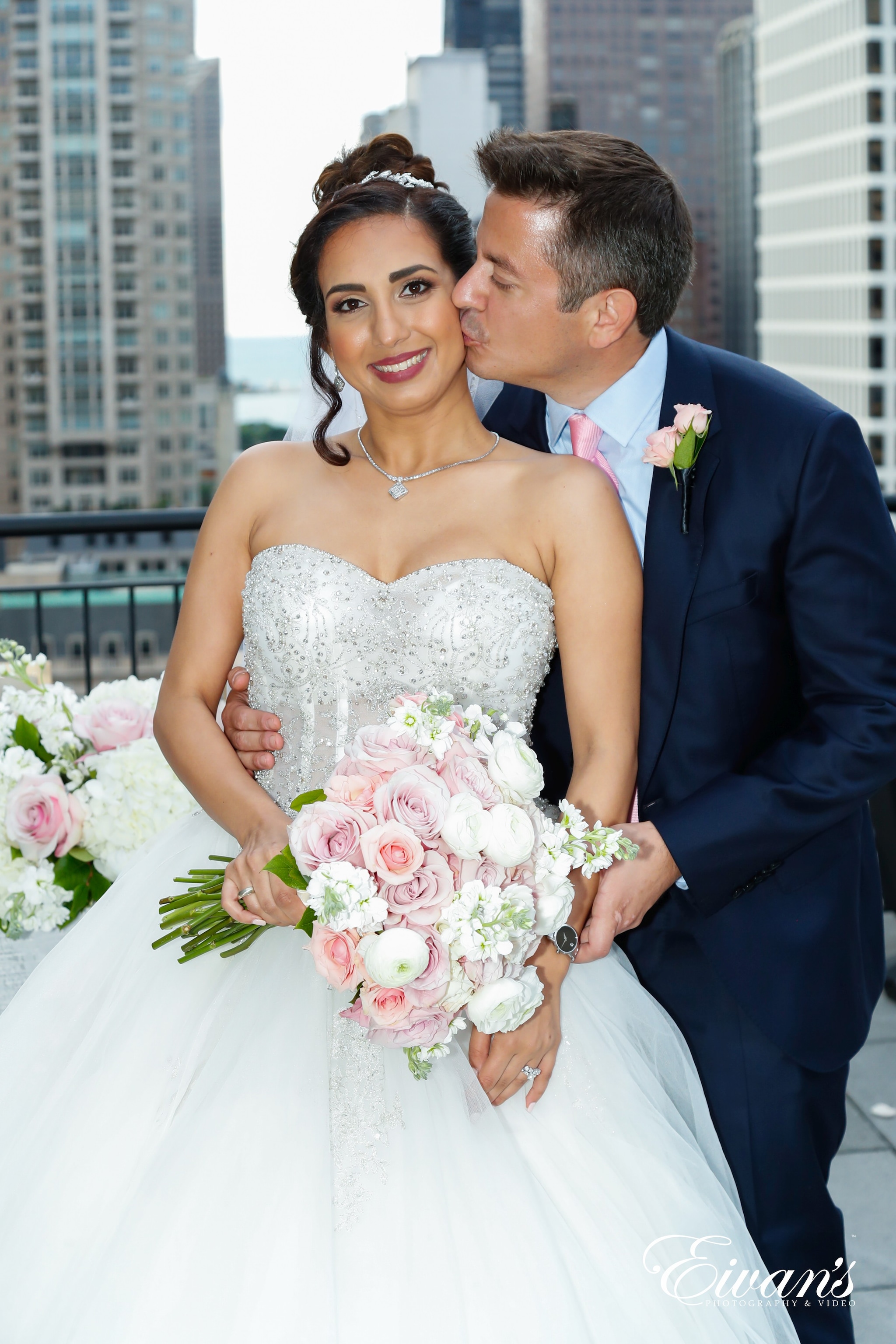 woman in white wedding dress holding bouquet of flowers