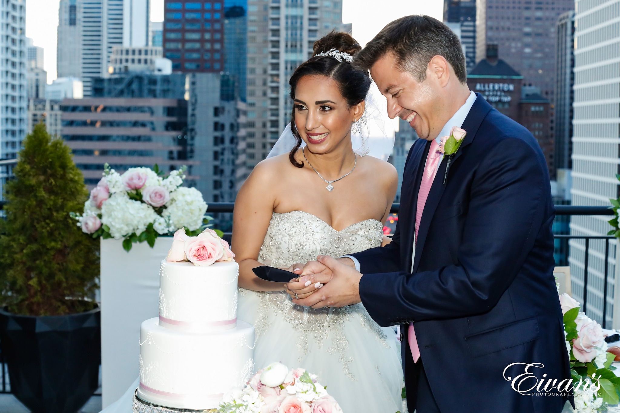 man in blue suit and woman in white wedding dress