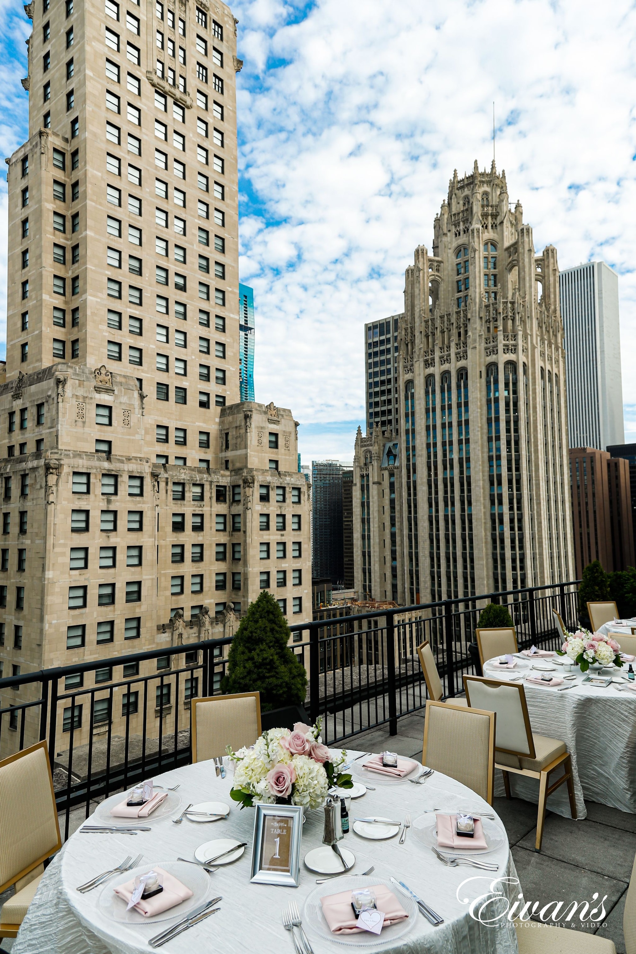 white and brown dining table and chairs set near high rise buildings during daytime