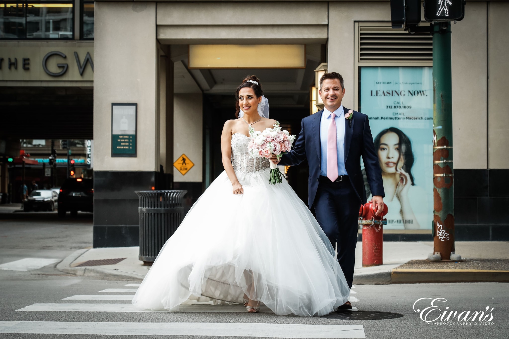 woman in white wedding gown holding bouquet of flowers