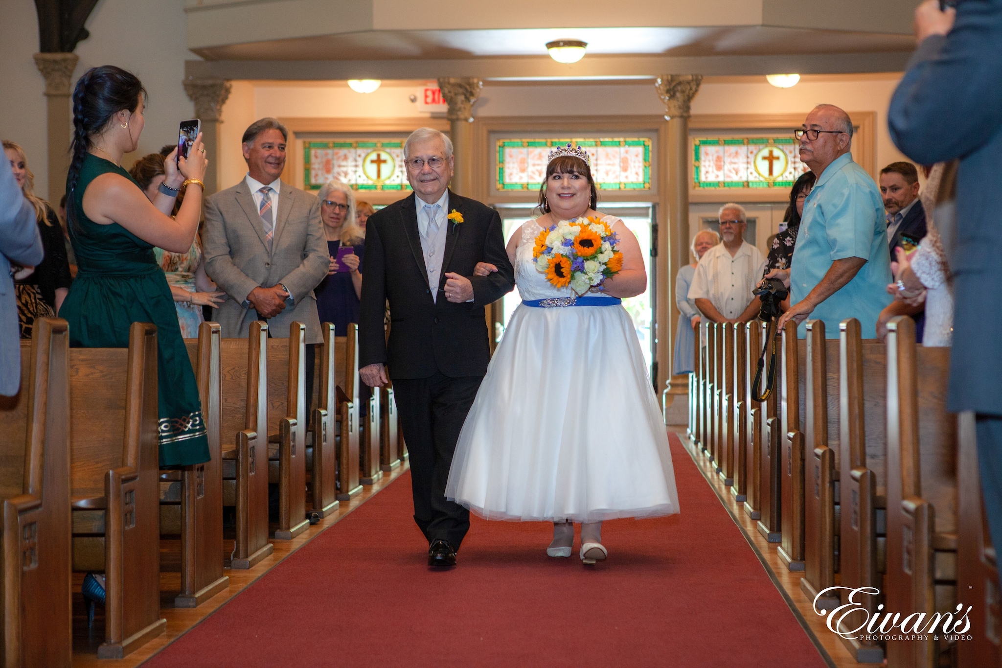 man in black suit jacket standing beside woman in white dress