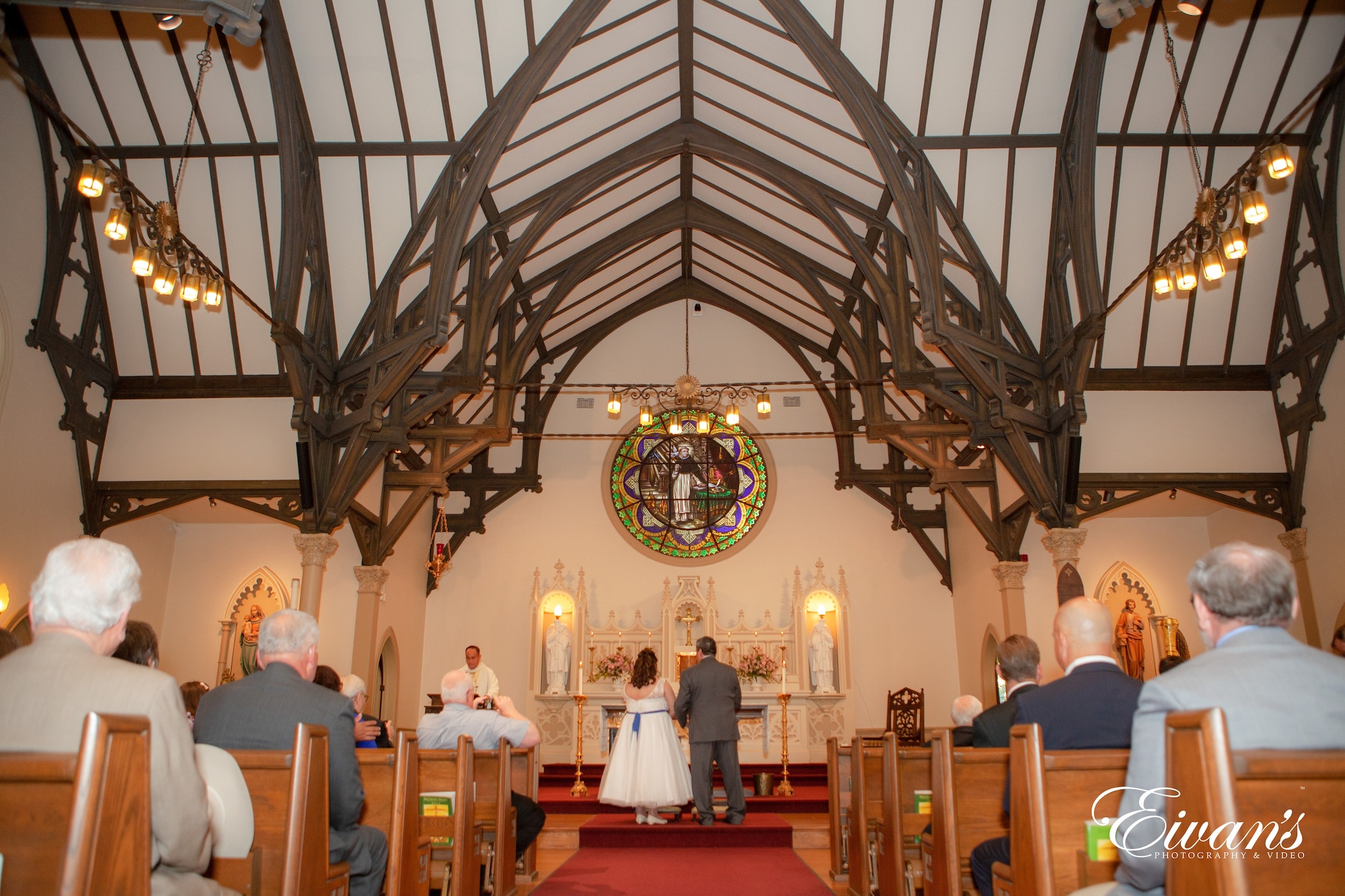 people sitting on chairs inside church