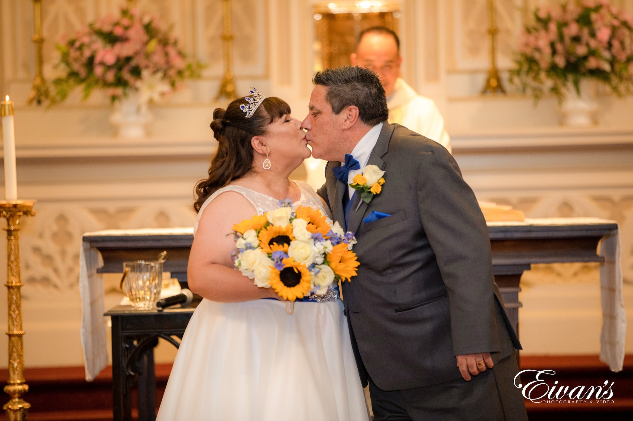 man in black suit jacket and woman in white wedding dress