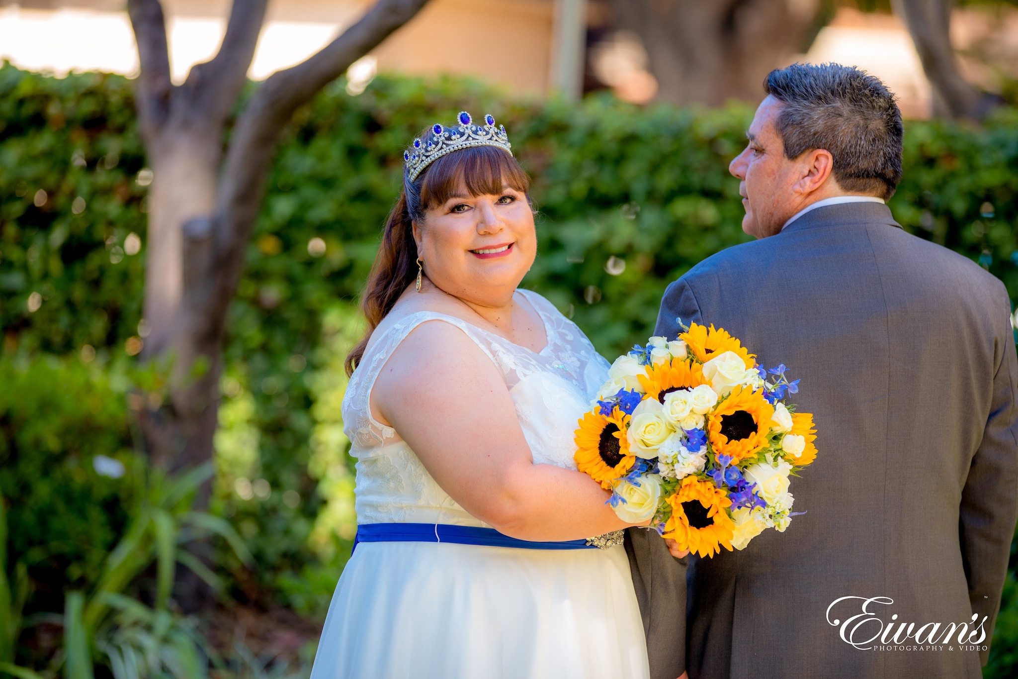 man and woman in wedding dress holding bouquet of flowers