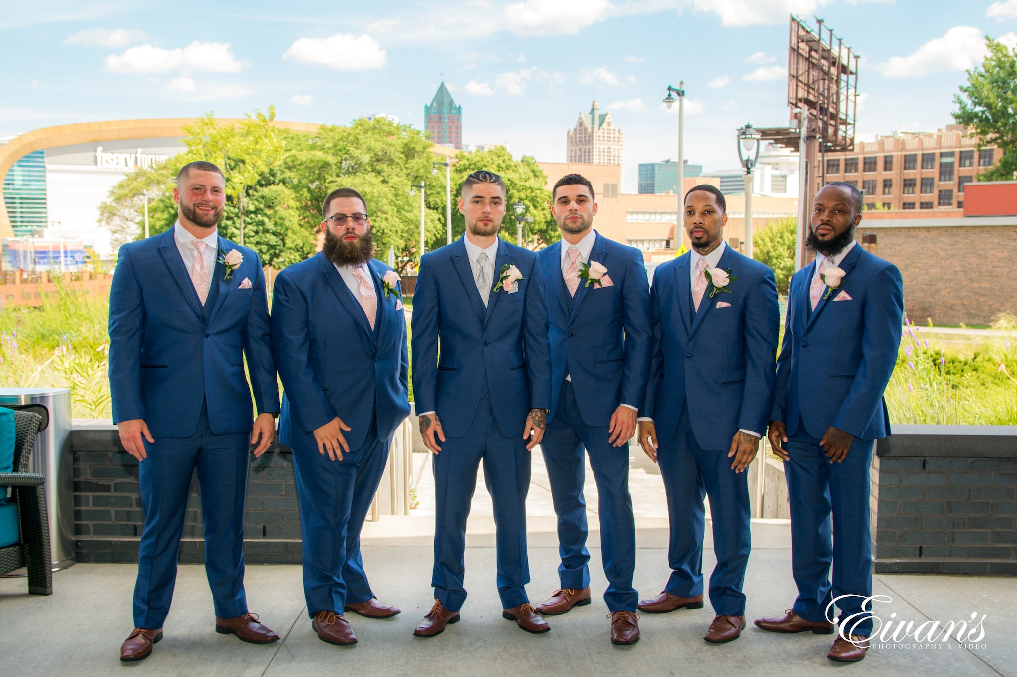 group of men in blue suit standing on brown floor