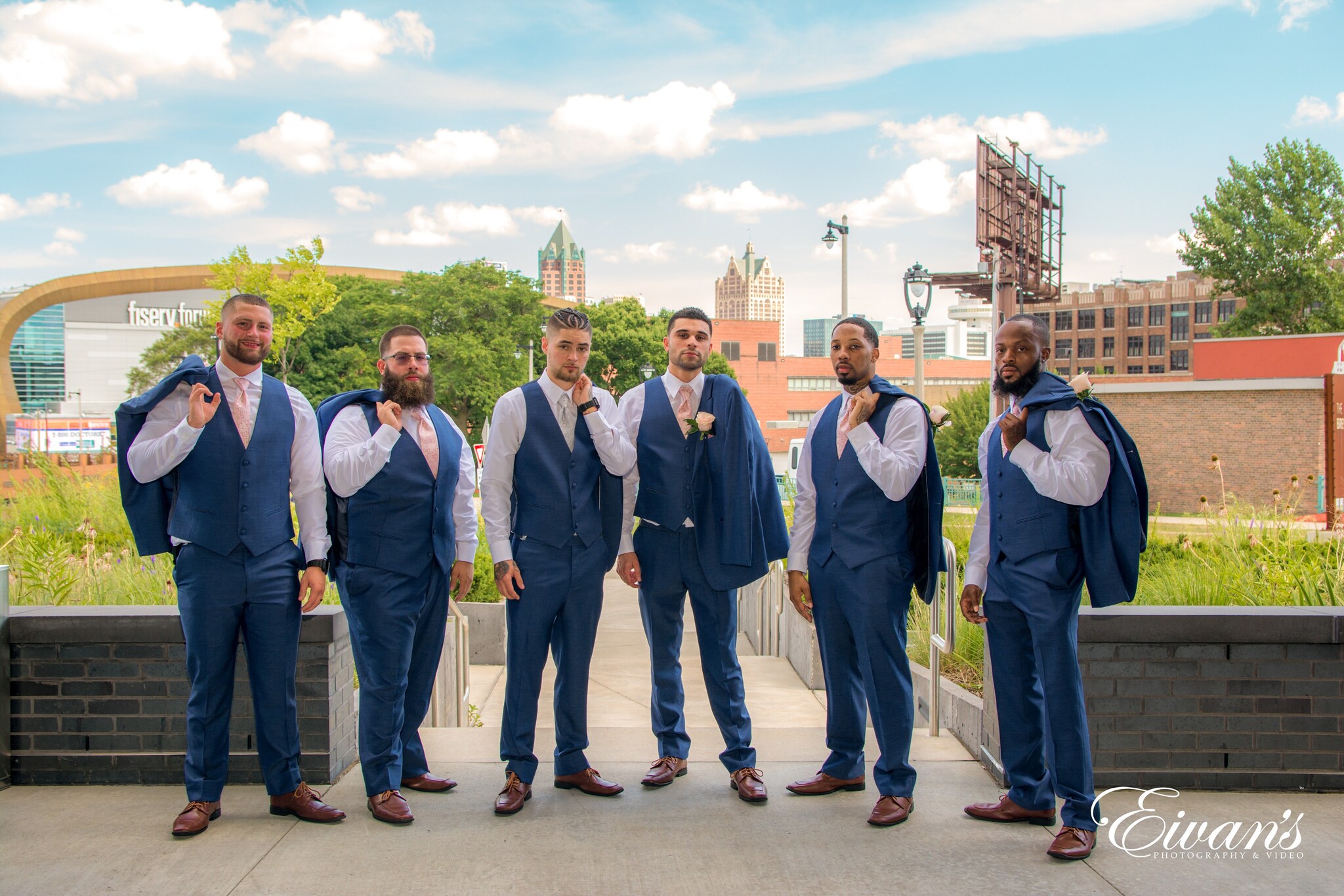 group of people standing on brown concrete floor during daytime