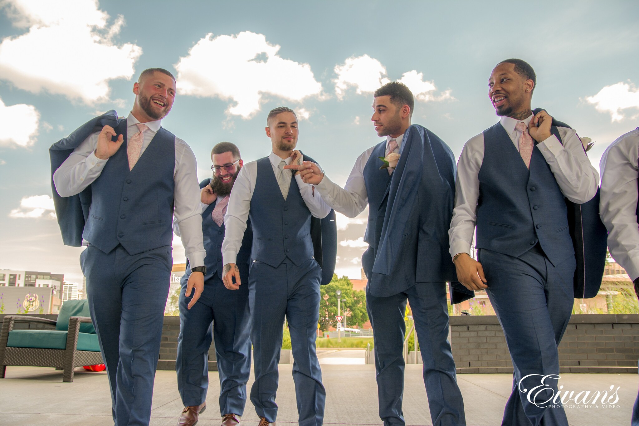 2 men in blue suit standing beside man in blue suit jacket