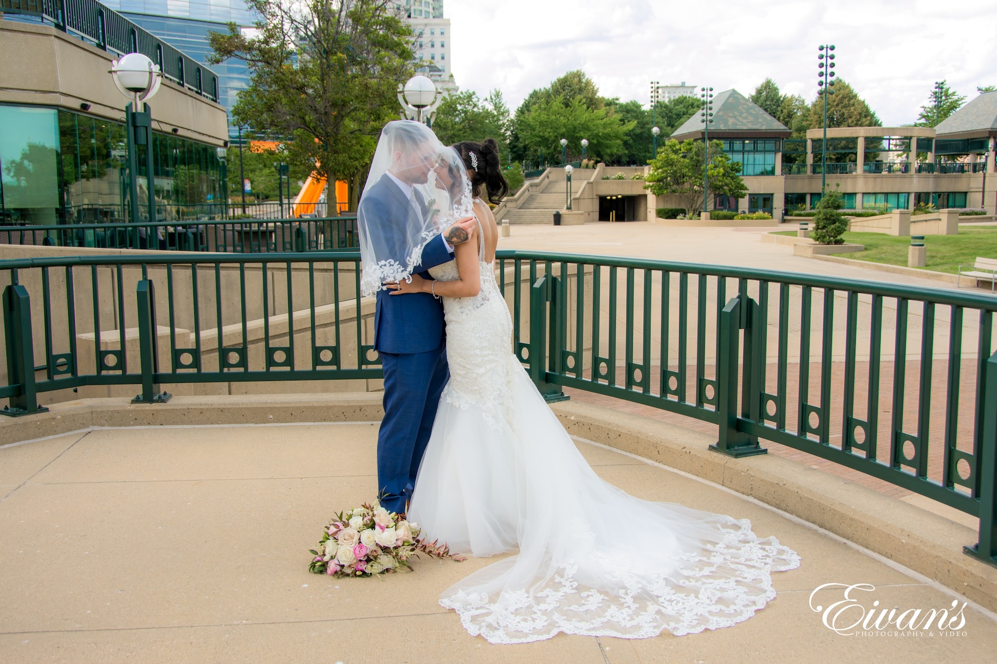 woman in white wedding gown holding bouquet of flowers