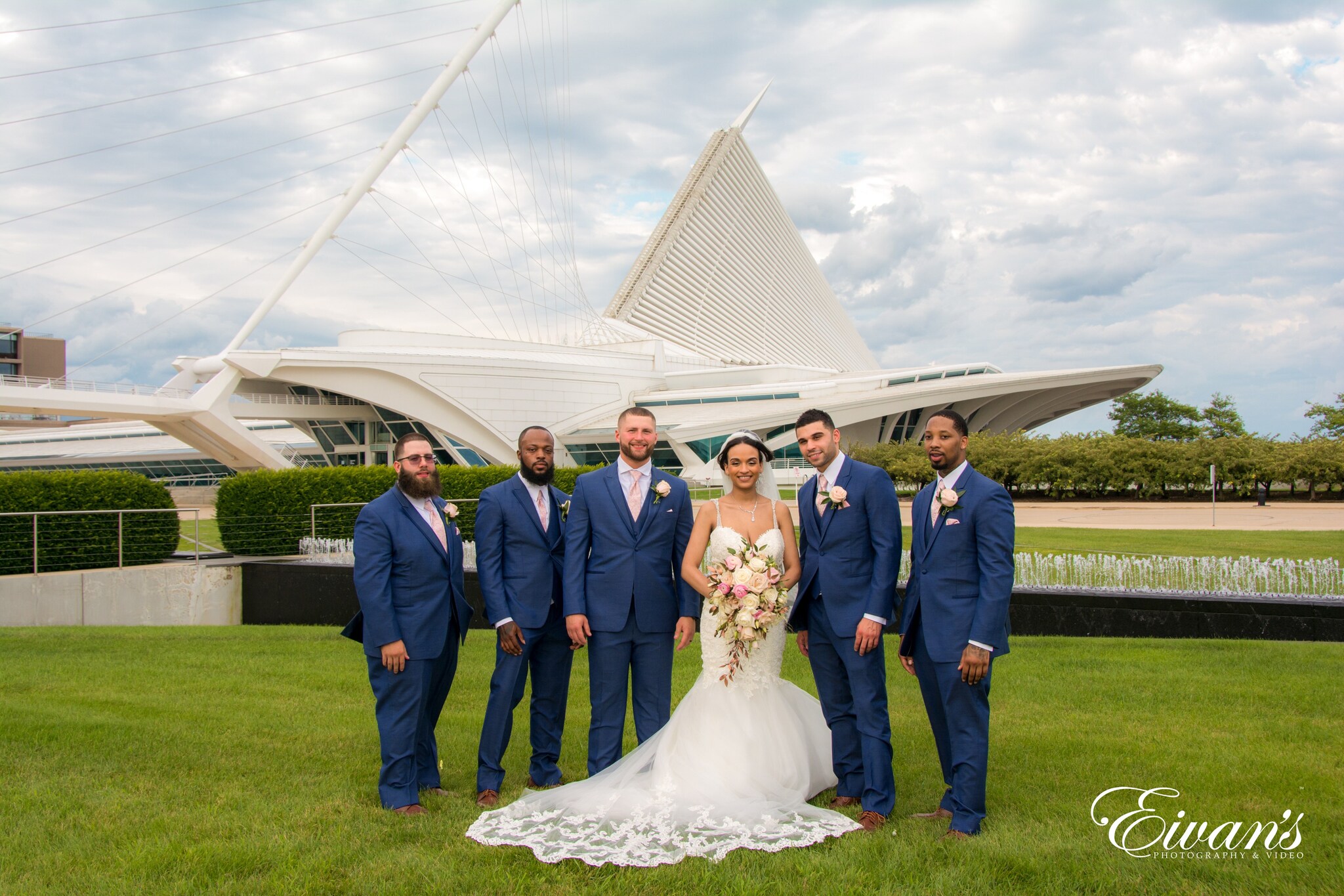 man in black suit jacket and woman in white wedding dress