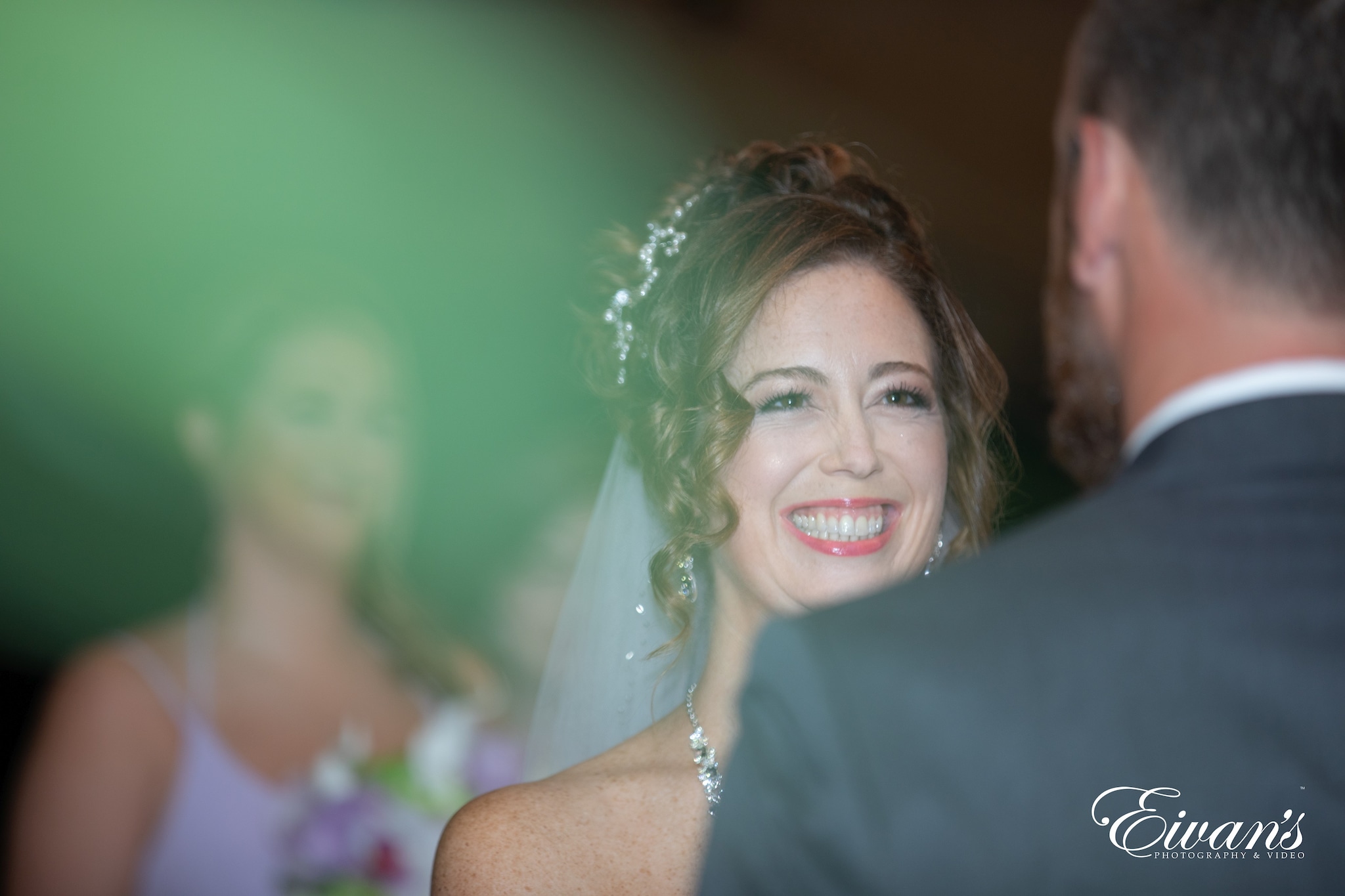 woman in white wedding dress smiling