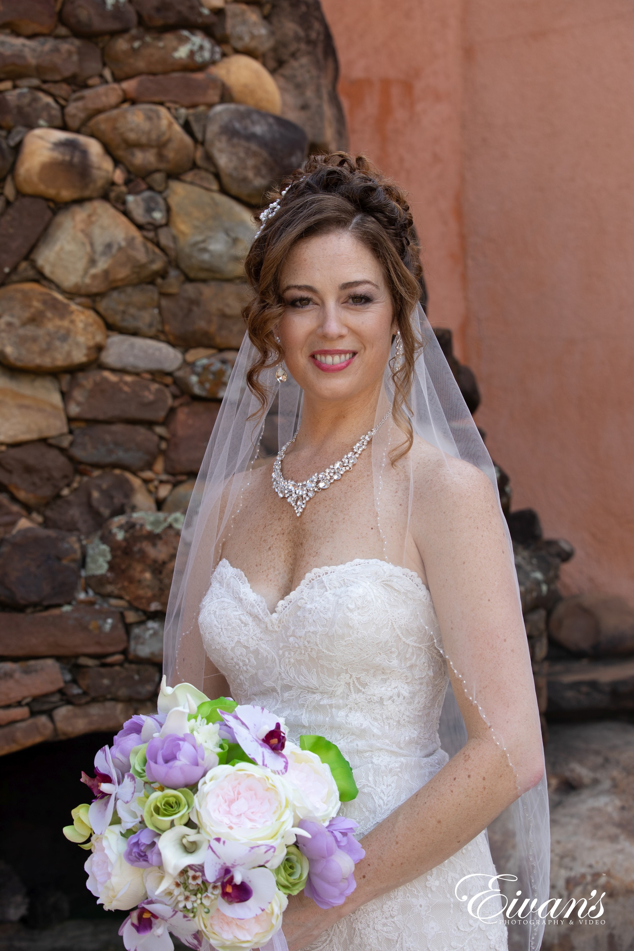 woman in white wedding dress holding bouquet of flowers