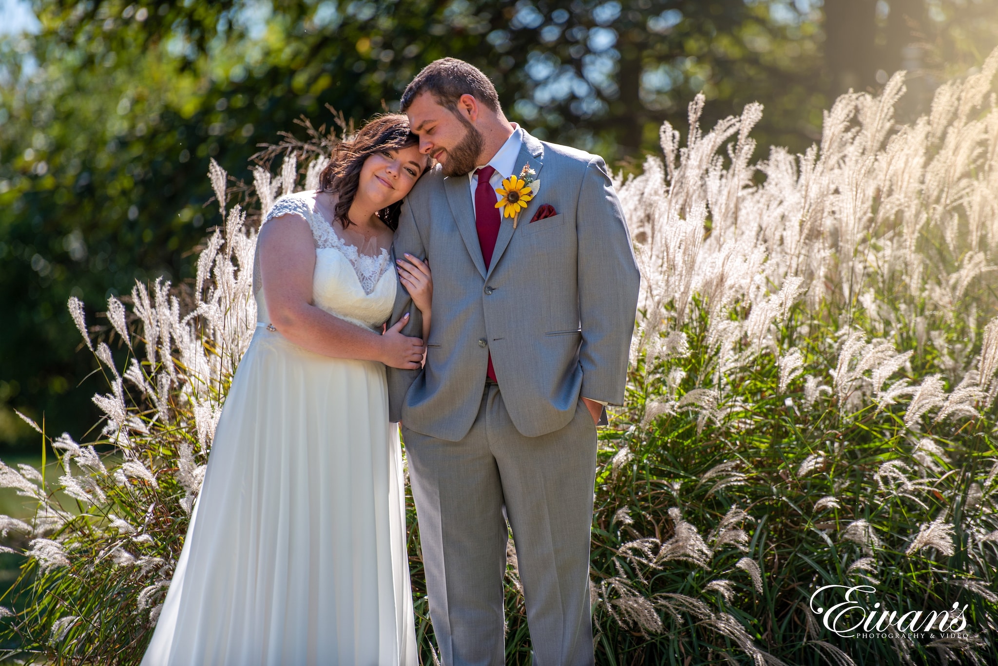 man in black suit and woman in white wedding dress