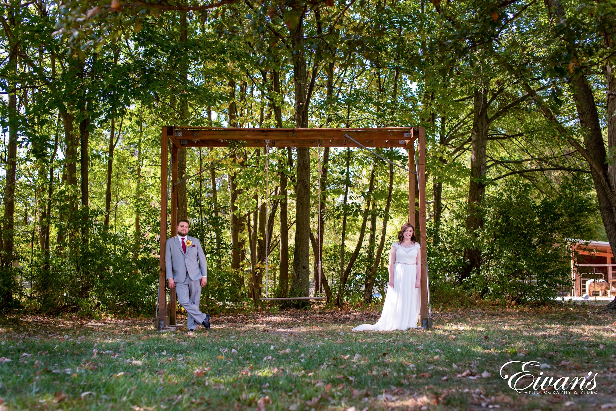 man and woman in white dress walking on forest during daytime
