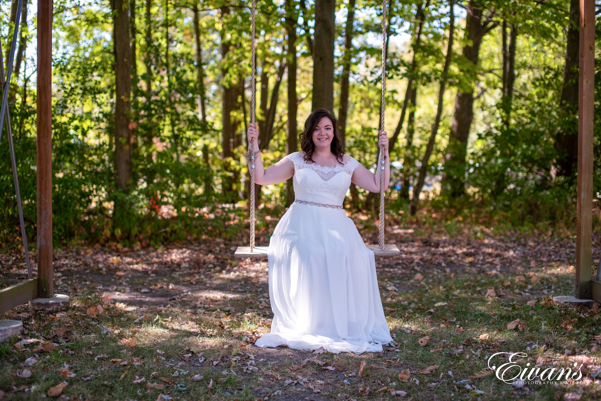 woman in white dress on swing