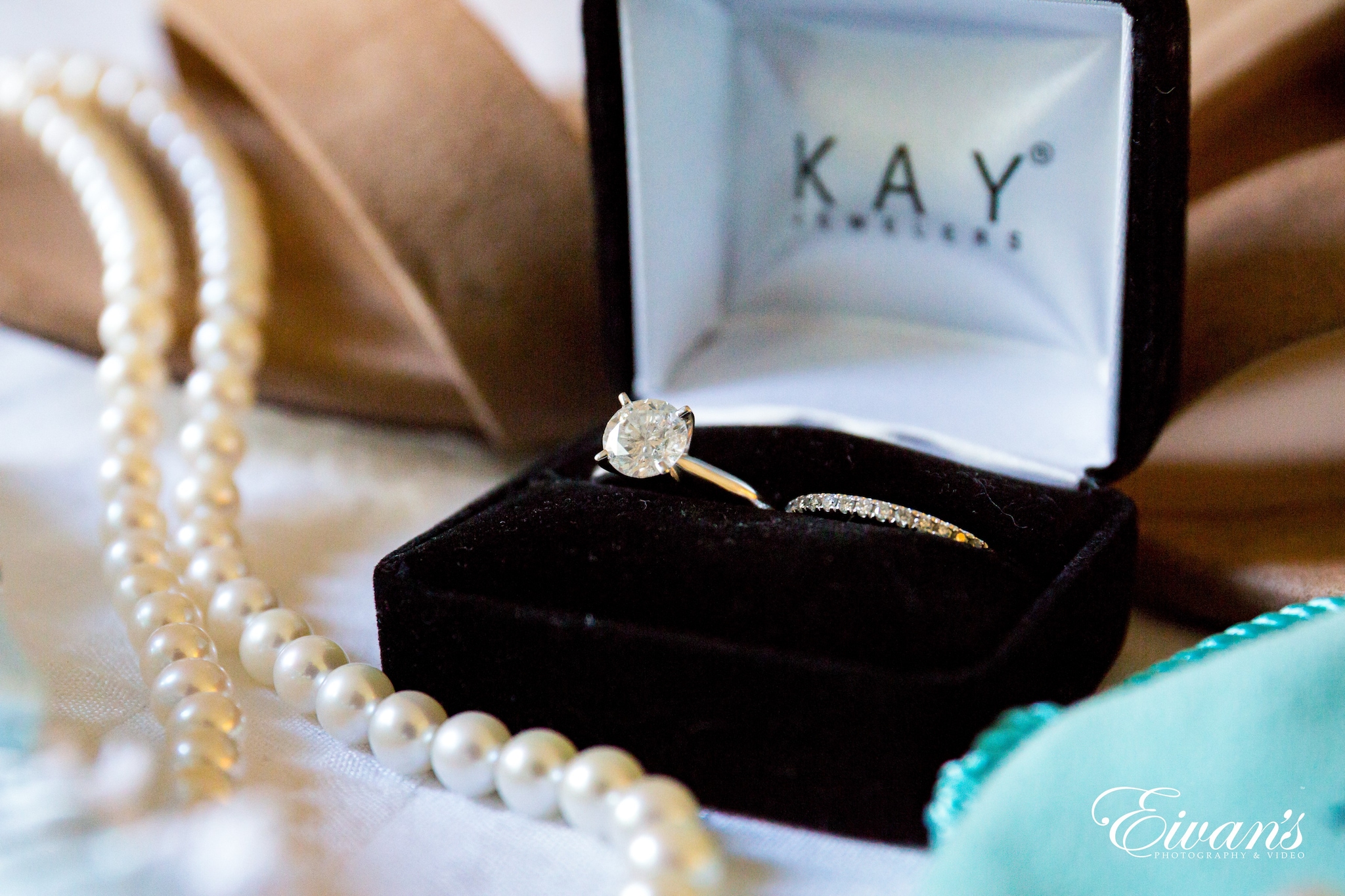 white pearl necklace on black box